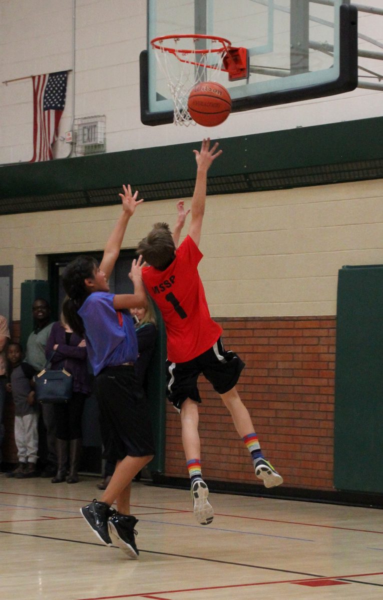Kyle Wisniewski finishing through contact at the rim for Manning Middle School, March 2016