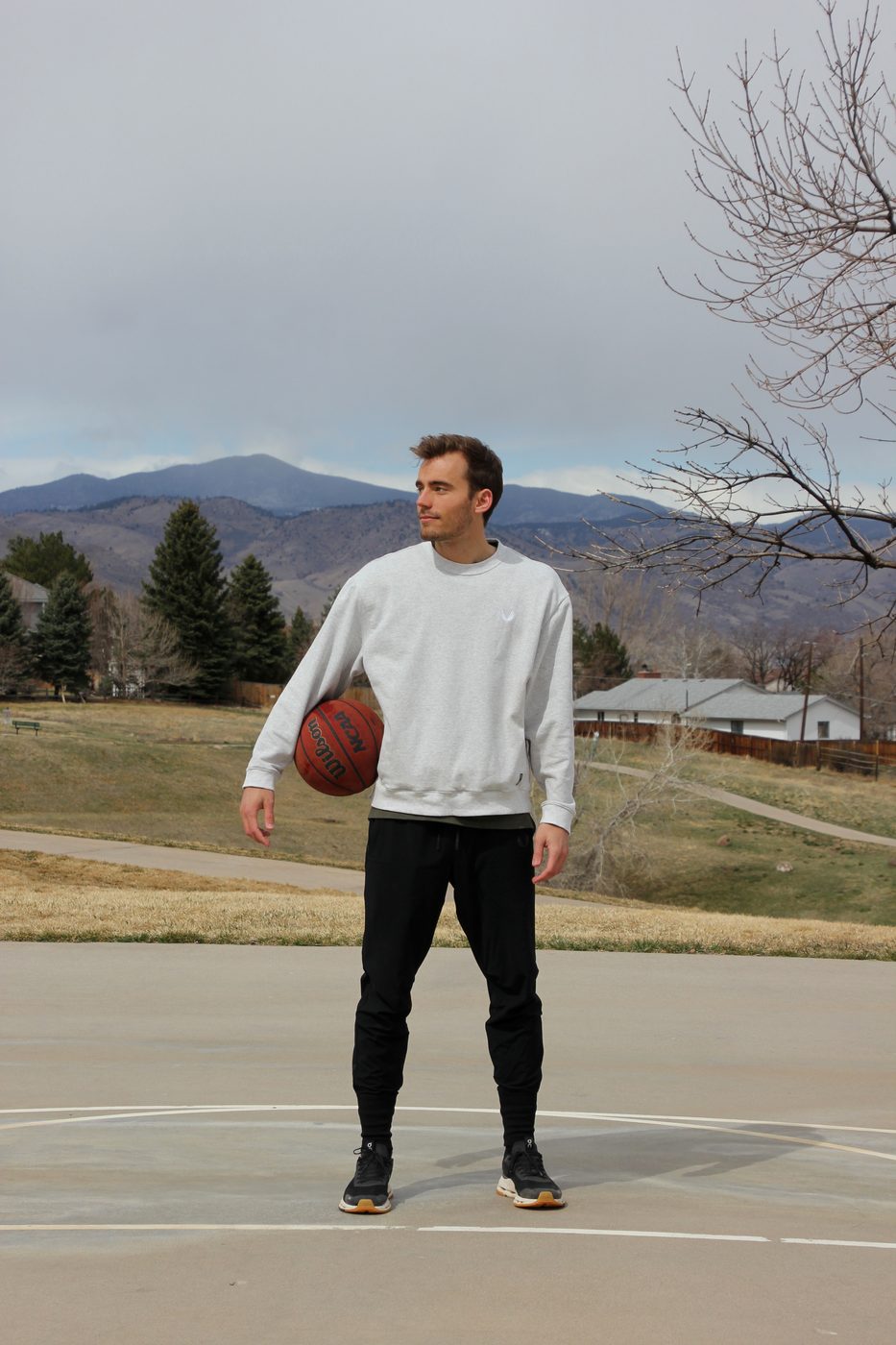 Kyle Wisniewski, Denver-metro basketball shooting coach, portrait with ball, 2025