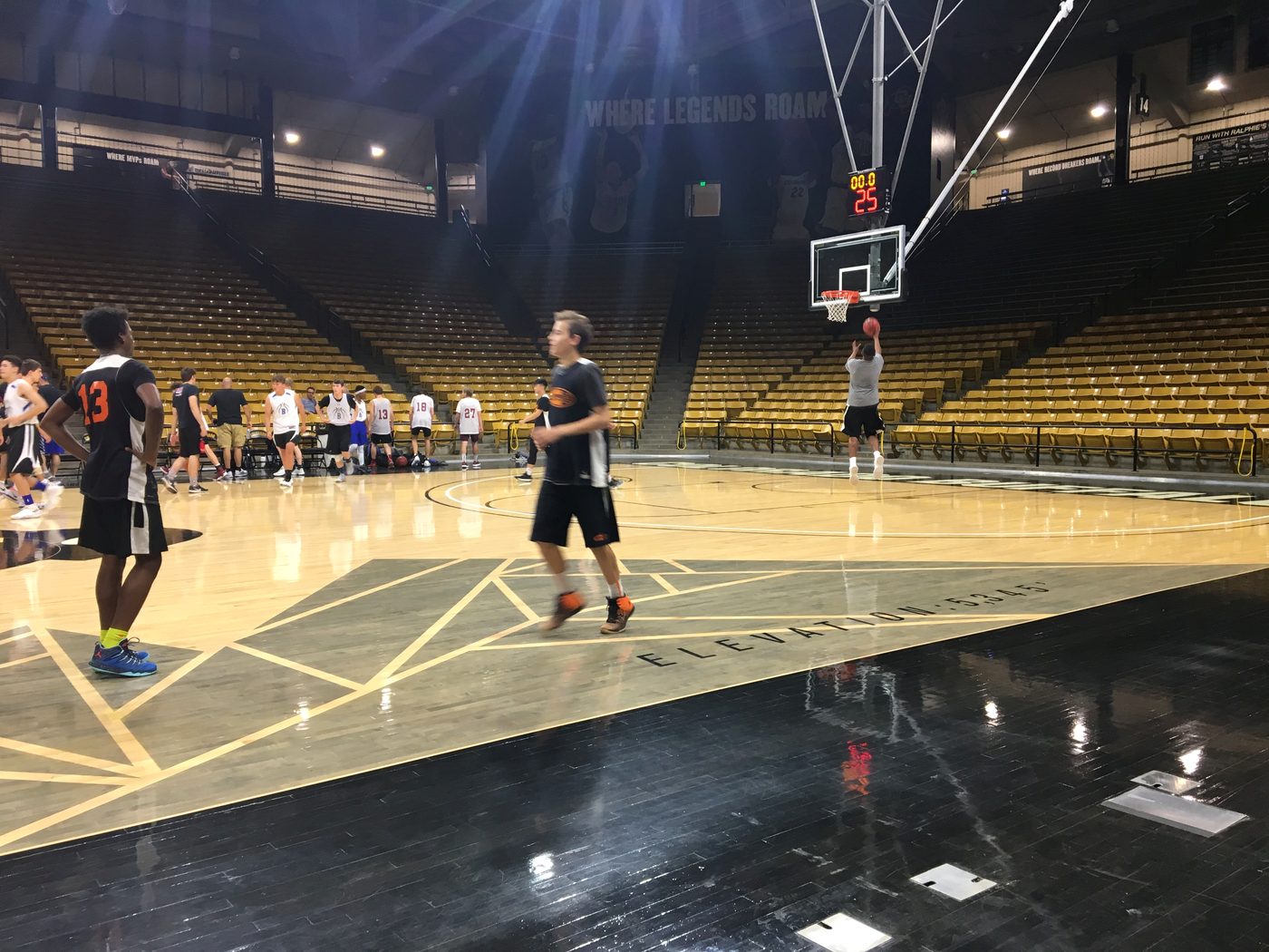 Kyle Wisniewski shooting alone in the CU Boulder Events Center at basketball camp, 2018