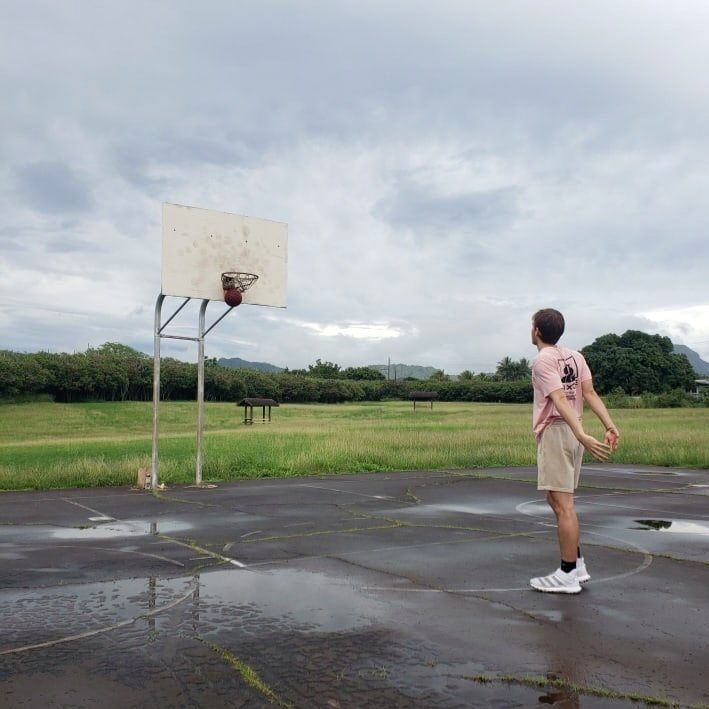 Kyle Wisniewski on an outdoor basketball court in Hilo, Hawaii