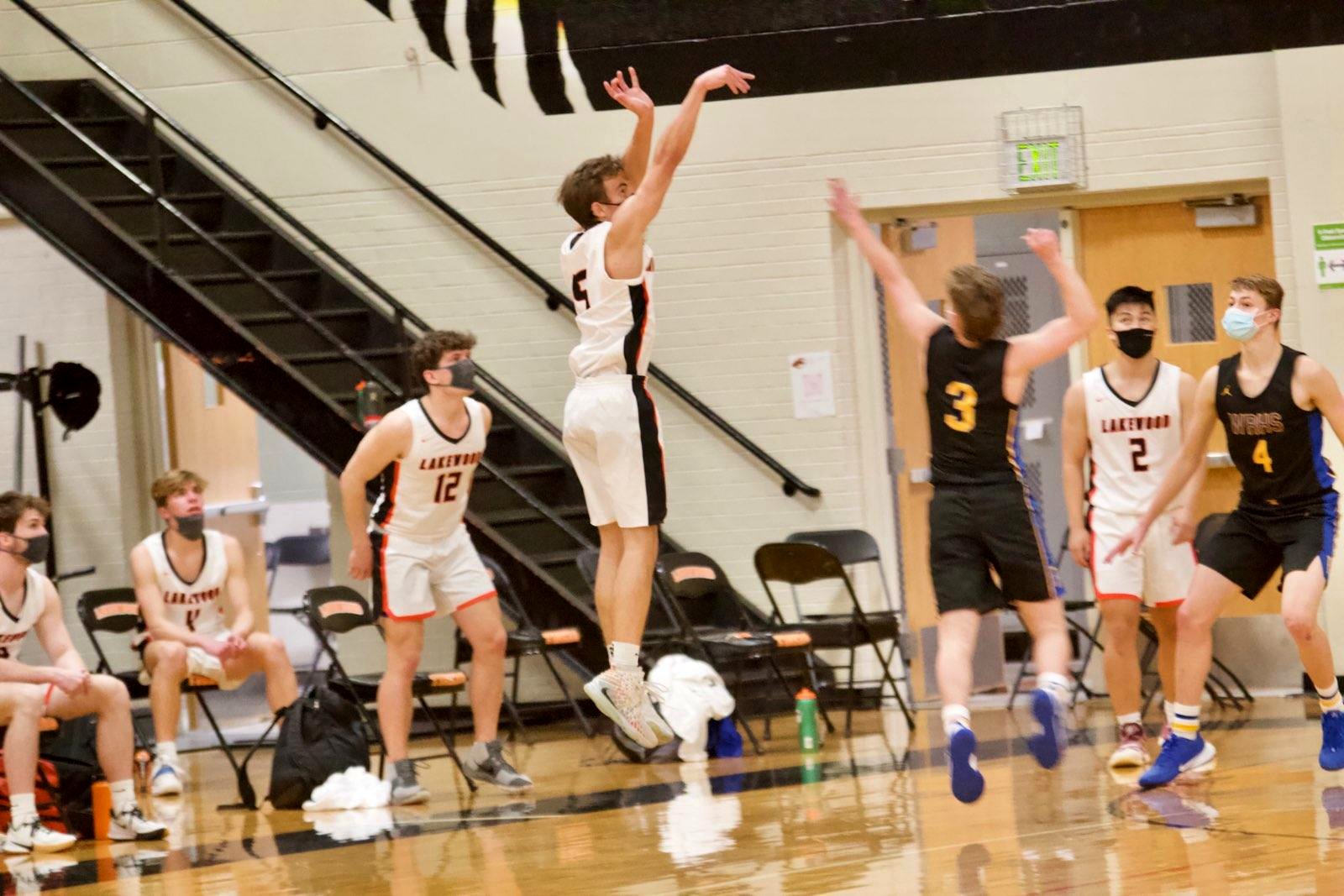 Kyle Wisniewski follow-through on a jump shot for Lakewood varsity