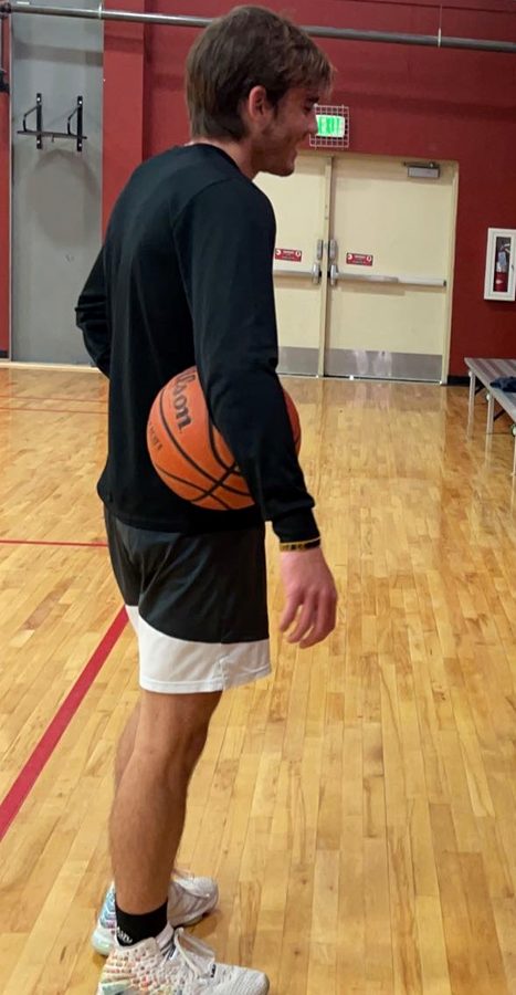 Kyle Wisniewski, basketball shooting coach, working with athletes in the gym