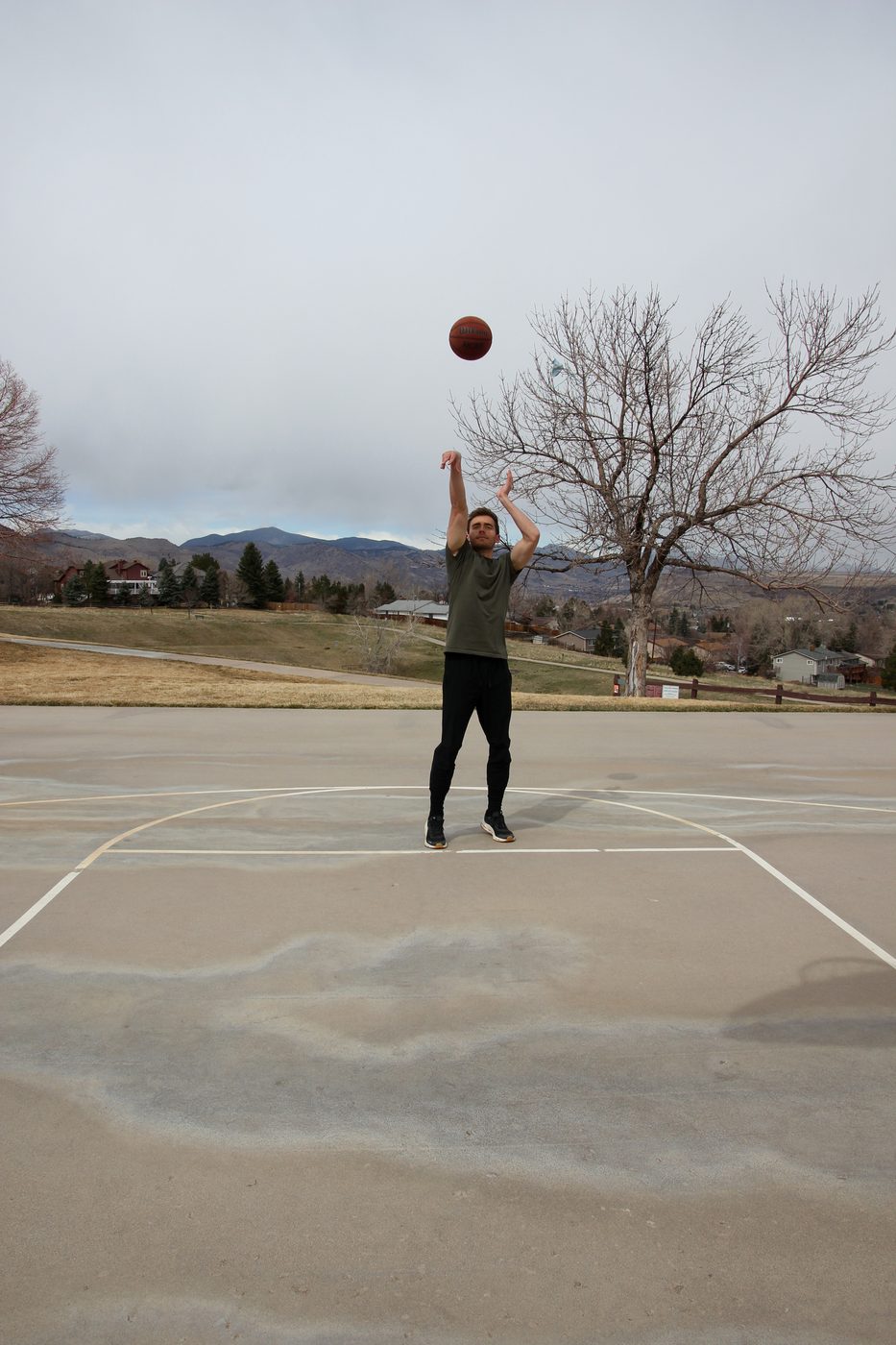 Kyle Wisniewski shooting follow-through on an outdoor Colorado court, 2025