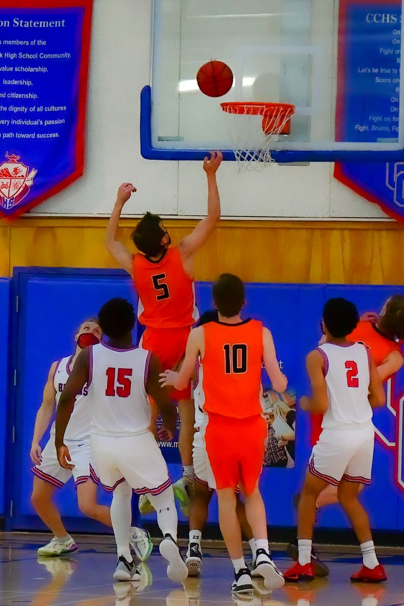 Kyle Wisniewski rising over defenders at the rim, Lakewood varsity 2021